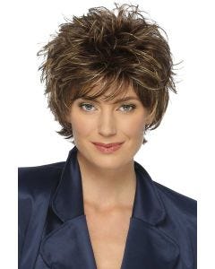 Woman in a long teased medium brown pixie wig with fringe bangs