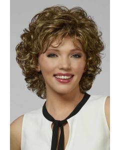 Woman in a shoulder length curly golden brown layered bob wig