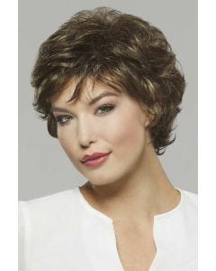 Woman in a medium length brown pixie wig with textured layering throughout