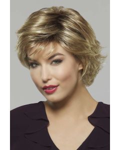 Woman in a blonde textured bob wig with longer hair on top and side bangs