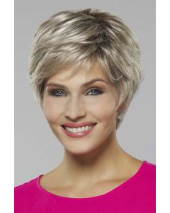 Woman in a platinum blonde long pixie wig with side bangs