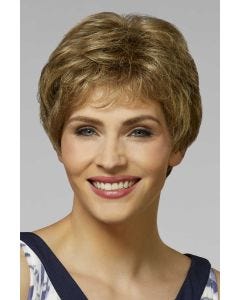 Woman in a warm blonde textured pixie wig
