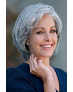 Woman in a light brown chin length lace front bob wig with extra volume along the forehead