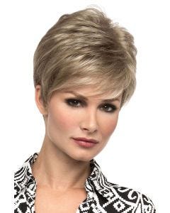 Woman in an asymmetrical blonde wig with textured side bangs