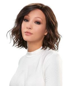 Woman in a petite shoulder length curly dark auburn lace front wig
