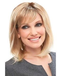 Woman in a shoulder length blonde blunt bob wig with side bangs