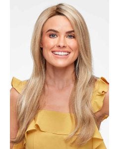 Woman in an extra long semi-wavy medium blonde lace front wig