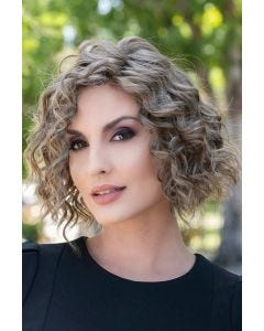 Woman in a chin length dark grey curly lace front wig