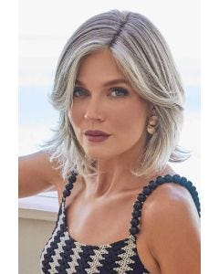 Woman in a shoulder length grey long layered lace front bob wig with side bangs