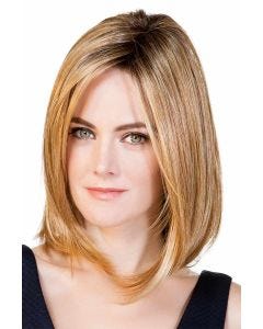 Woman in a 14" warm blonde straight hair topper blended with her hair Woman in a 14" warm blonde straight hair topper blended with her hair