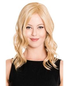 Woman in a 14" warm light blonde wavy hair topper blended with her hair