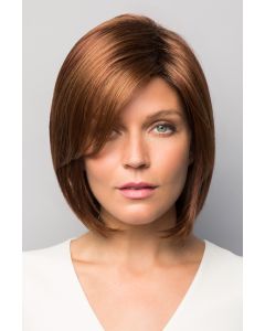 Woman in light auburn face framing bob wig with light layering along the face
