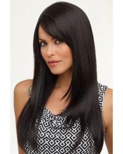 Woman in an extra long black wig with face front layers starting at the collar bone