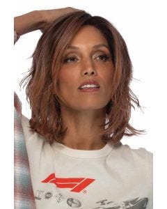 Woman in a shoulder length light blonde wavy lace front wig