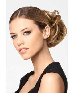 Woman in a clip on light auburn bun