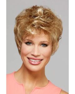 Woman in a choppy light auburn pixie wig with longer tousled layers on top