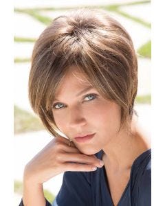 Woman in longer short brown wig with long layers to the chin