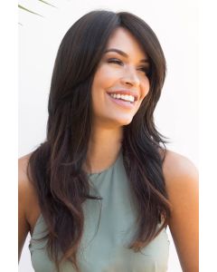 Woman in an extra long dark brown layered wig with long side bangs