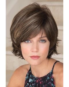 Woman in a chin length textured medium brown bob wig with choppy layers and side bangs