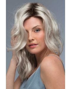 Woman in a past the shoulders curly platinum blonde lace front wig