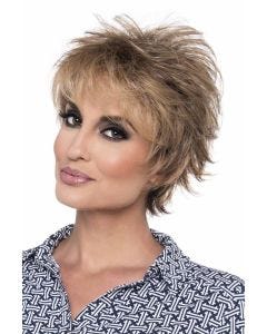 Woman in a short dark brown layered human hair wig with wispy bangs