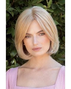 Woman in a 9" light blonde human hair topper for thinning hair