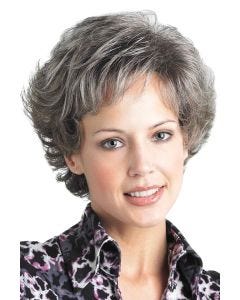 Woman in a petite short medium grey curly wig with short bangs