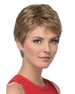 Woman in a petite short layered dark blonde pixie wig