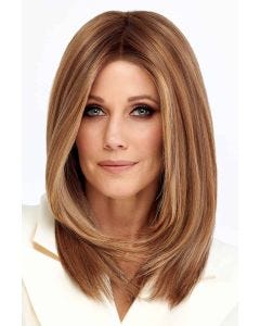 Woman in a past the shoulders light blonde straight lace front wig with long layers