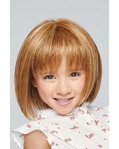 Little girl in a shoulder length light auburn bob children's wig with bangs