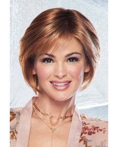 Woman in a medium auburn chin length bob wig with shaped layers and side swept bangs