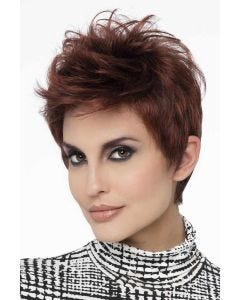 Woman in a tousled dark red pixie wig with longer layers on top