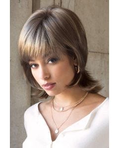 Woman in brown medium length shag wig with layers and flipped out ends