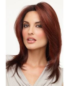 Woman in a past the shoulders deep red wig with long dramatic layers