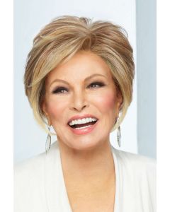 Raquel Welch in a chin length light auburn stacked bob wig with side bangs