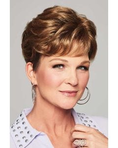 Woman with a dark ash blonde short hair topper with fringe bangs