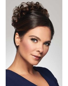 Woman in a curly dark auburn clip-on hair piece