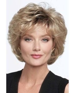 Woman in large dark blonde cropped shag wig with full curly layers and textured bangs