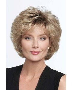 Woman in dark blonde cropped shag wig with full curly layers and textured bangs