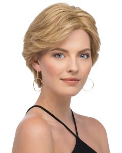 Woman in a long dark blonde layered remy human hair pixie wig