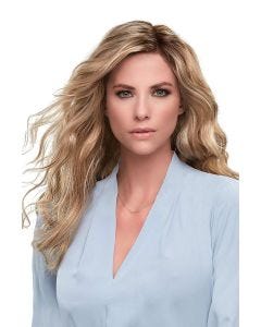 Woman in a large extra long wavy light brown lace front wig
