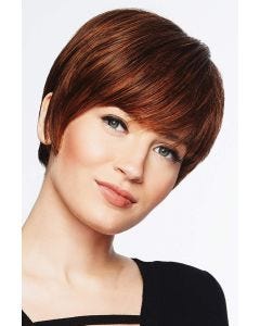 Woman in a long layered medium auburn pixie wig with fringe bangs