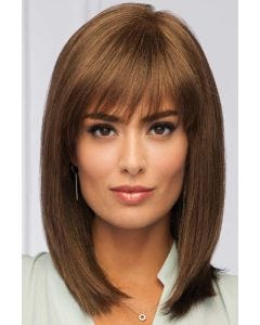 Woman in a large past the shoulders medium brown blunt cut wig with blunt bangs