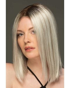 Woman in a past the shoulders platinum blonde blunt cut wig