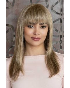 Woman in an extra long straight medium brown human hair wig with blunt bangs