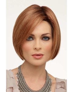 Woman in a blunt chin length medium red bob wig