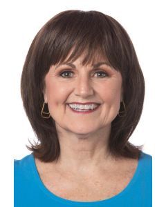 Woman in a 4.25" to 10.5" dark brown hair topper with blunt bangs