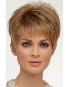 Woman in a classic blonde pixie wig with fringe bangs and longer layers on top