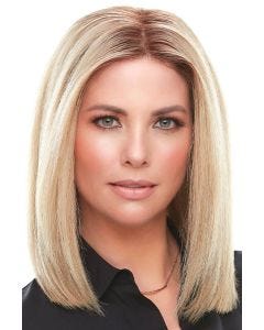 Woman in a 12" light blonde human hair topper for thinning hair