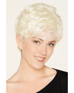 Woman in a curly platinum blonde pixie wig with fringe bangs